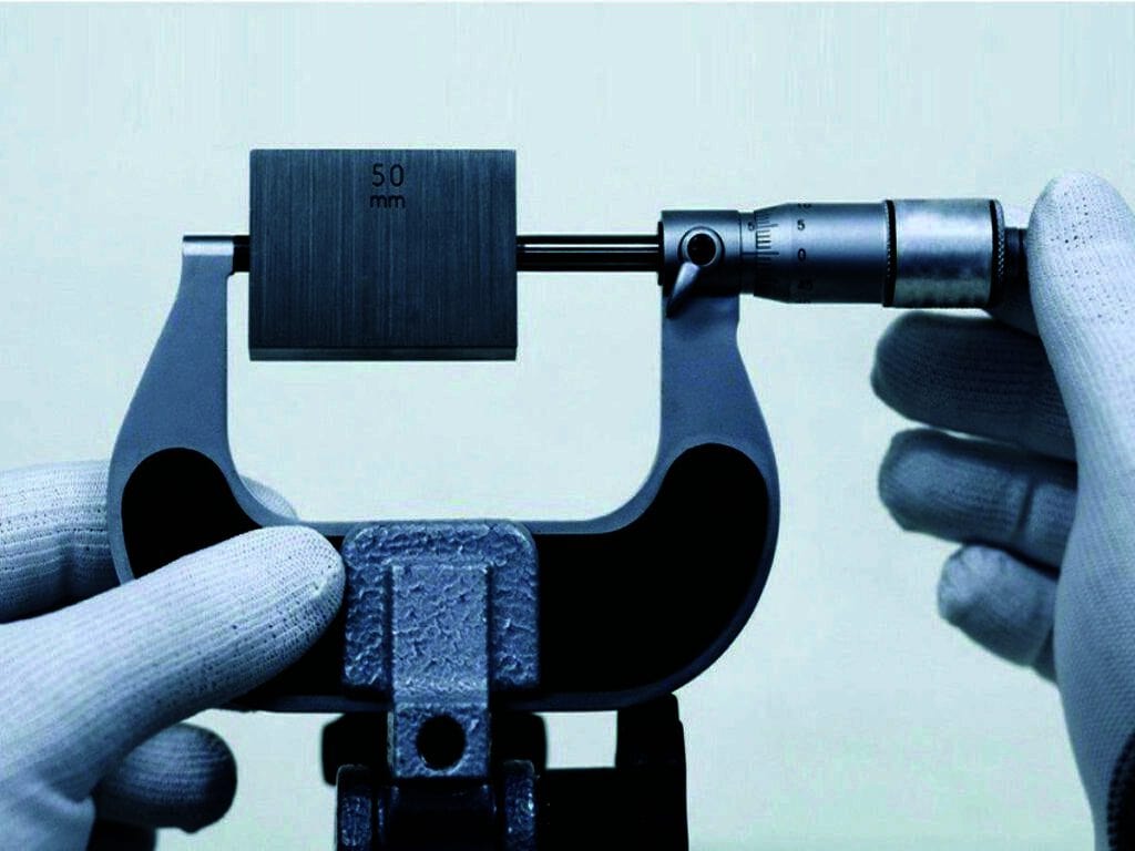 micrometer being calibrated